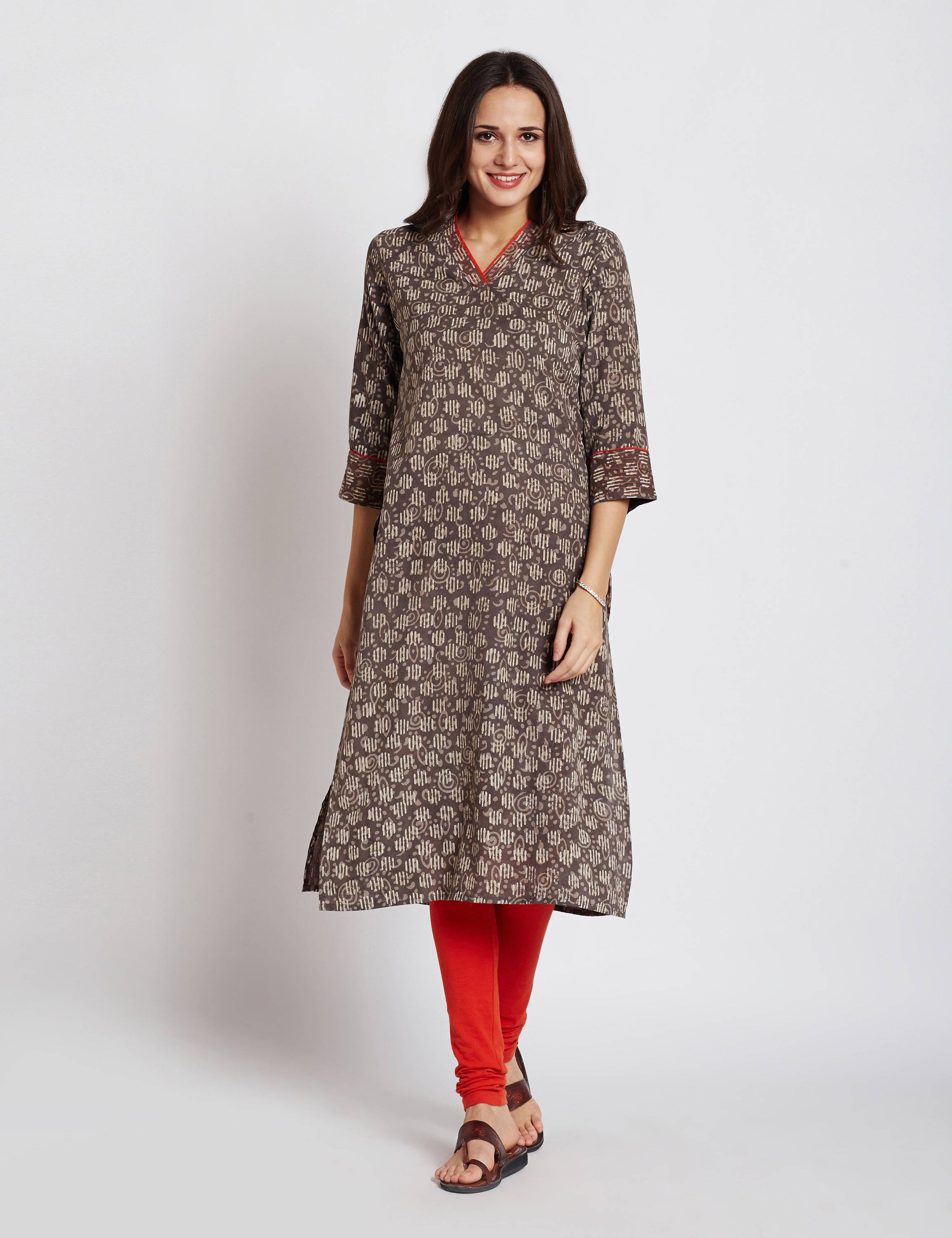 Hand block dabu printed ethnic long Indian kurta with contrast trims and orange hand embroidery on V neck and sleeves