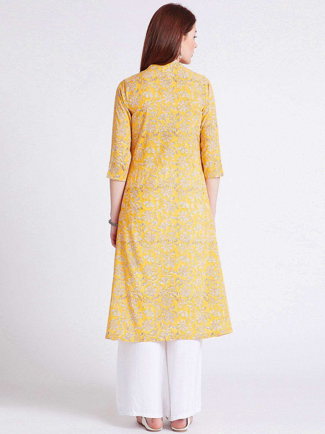 Hand block printed long kurta with front slit in turmeric yellow colour with pockets with button detailing on front