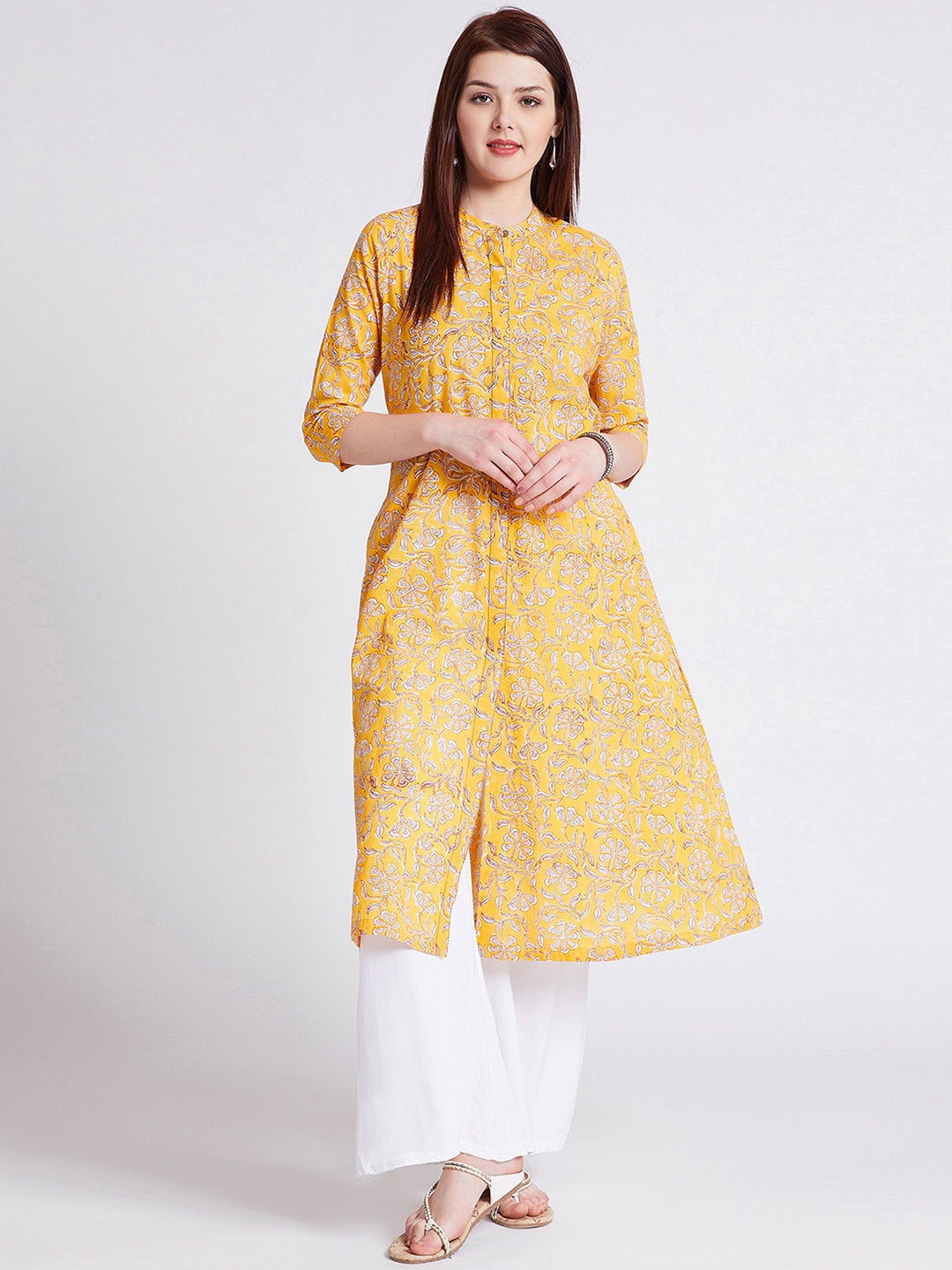 Hand block printed long kurta with front slit in turmeric yellow colour with pockets with button detailing on front
