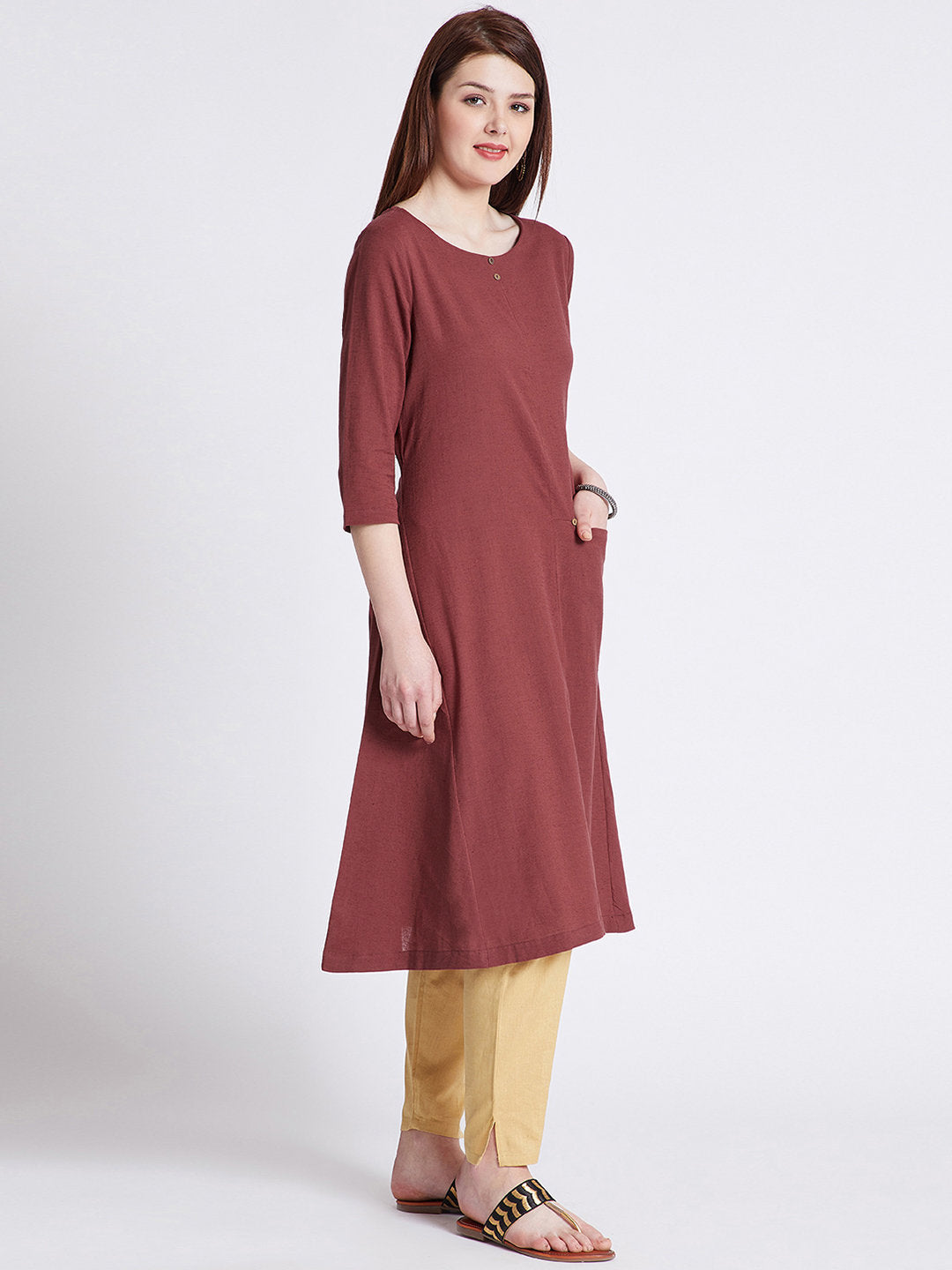Indian ethnic long kurta with front pocket in rust colour with button detailing on front & round hem