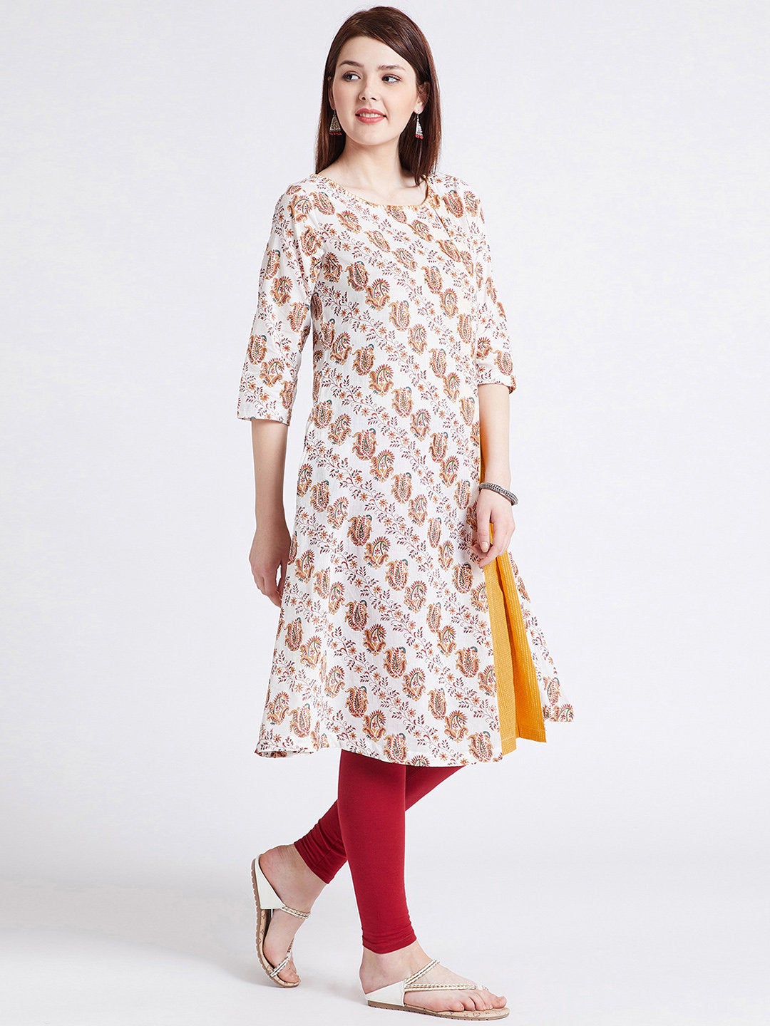 Hand block printed long kurta in white colour with front kali & hand work detailing on neck