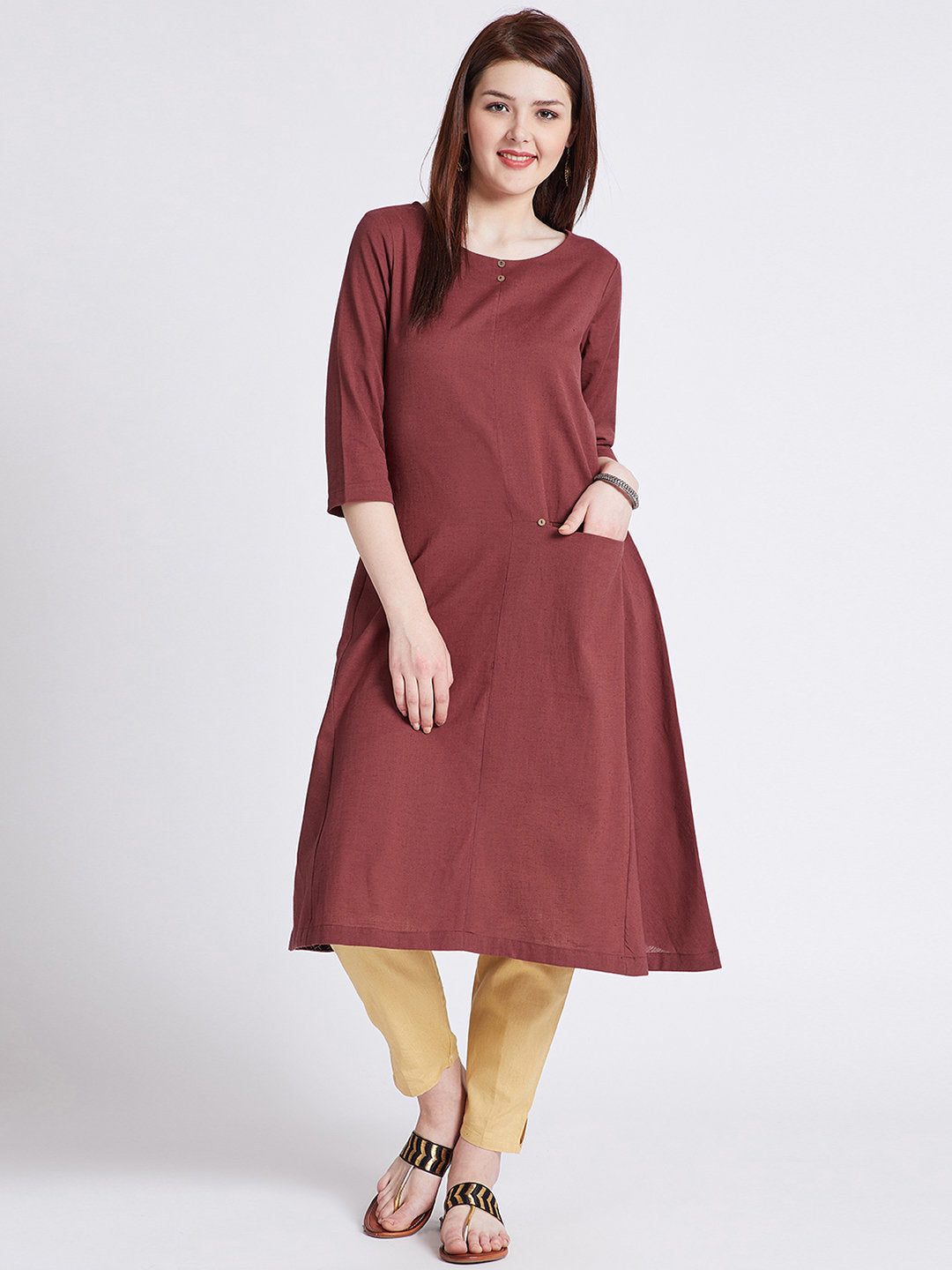 Indian ethnic long kurta with front pocket in rust colour with button detailing on front & round hem